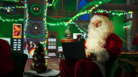 santa claus working on laptop