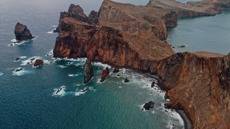 aerial view of dramatic cliffs and ocean coast