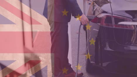 bandera de gran bretaña y la unión europea sobre el hombre cargando el coche eléctrico