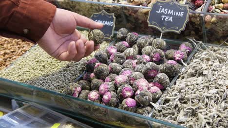 Close-Up-Shot-of-Man-Looking-at-Jasmine-Tea