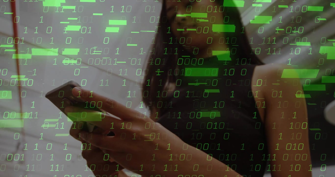 Dark-haired woman tapping smartphone initiating binary overlay streaming across technology office