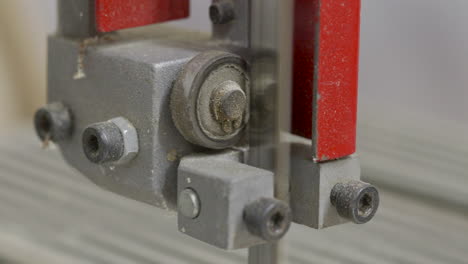 close-up of a bandsaw blade and roller