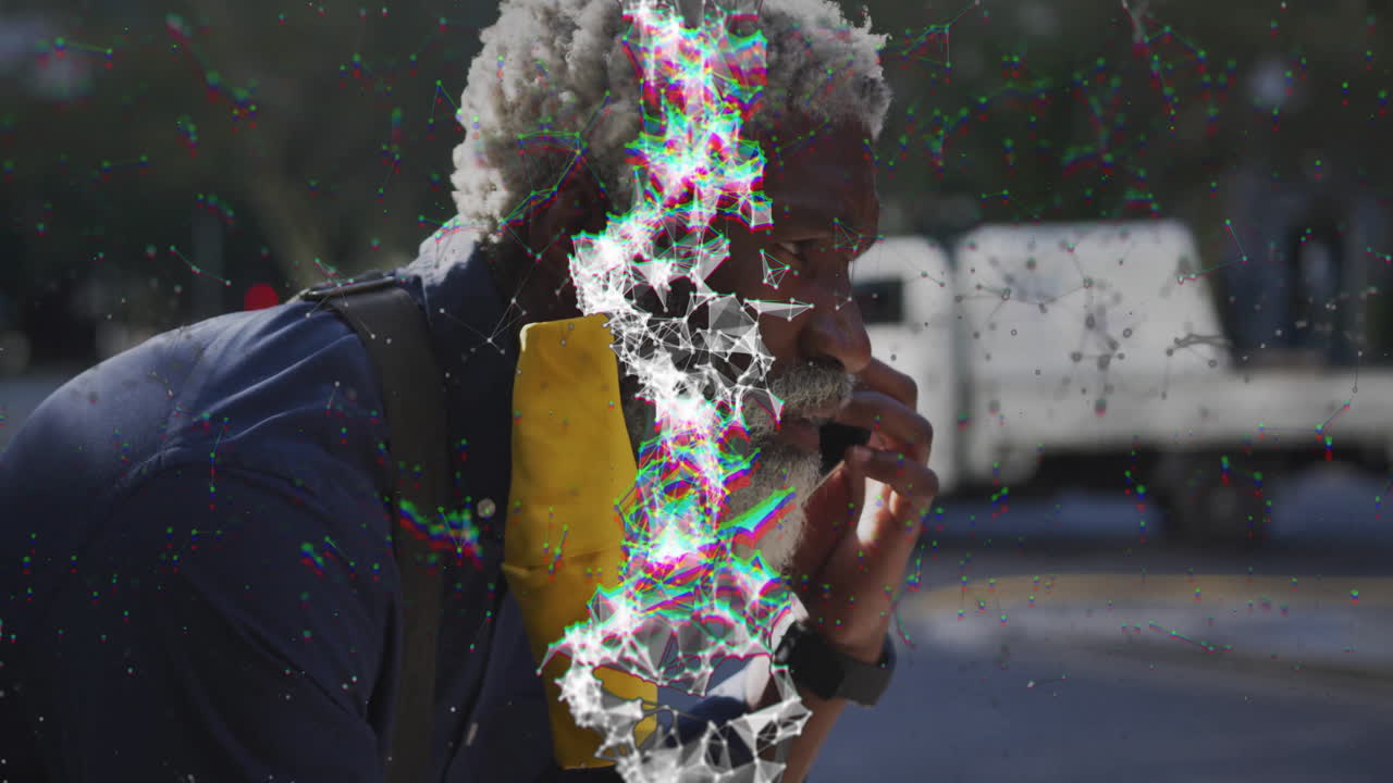 man standing outdoors under sunlight, projecting tech network overlay around smartwatch interface