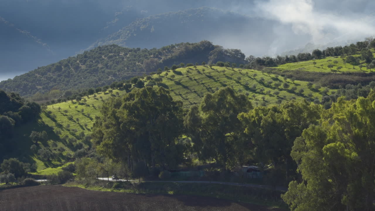 Green landscape and mist in Spain, panoramic pan view