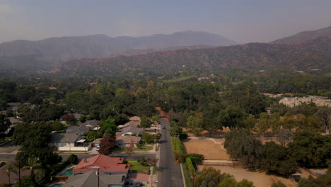 aerial view of a suburban neighborhood with hazy mountains in the background