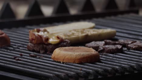 slow-motion footage of a chef starting to cook a grilled sandwich with mustard sauce, and a meat hamburger