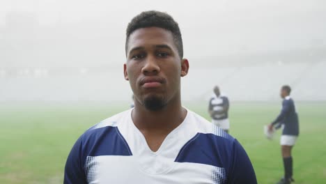 male rugby player standing in stadium 4k