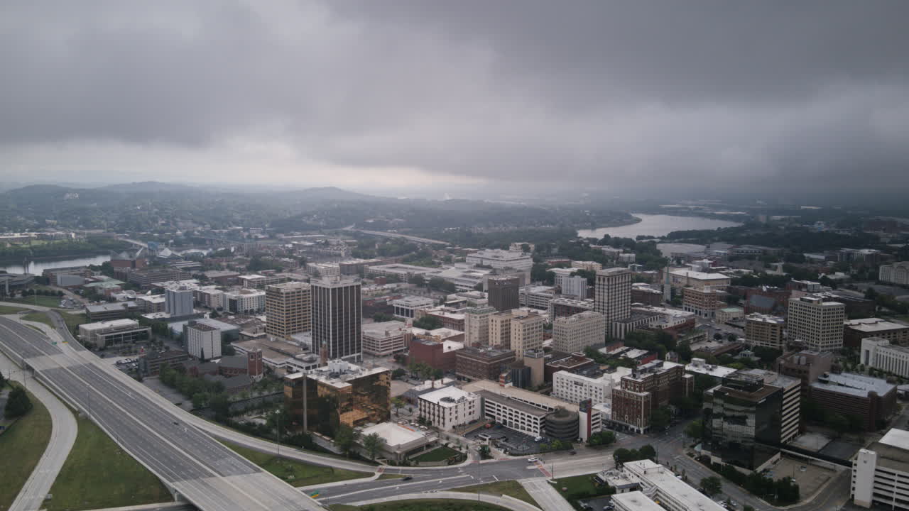 Aerial hyperlapse flying over the highway 27 with downtown Chattanooga, Tennessee in the background, in the morning with clouds