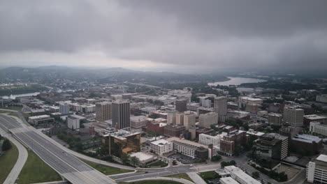 aerial hyperlapse flying over the highway 27 with downtown chattanooga, tennessee in the background, in the morning with clouds