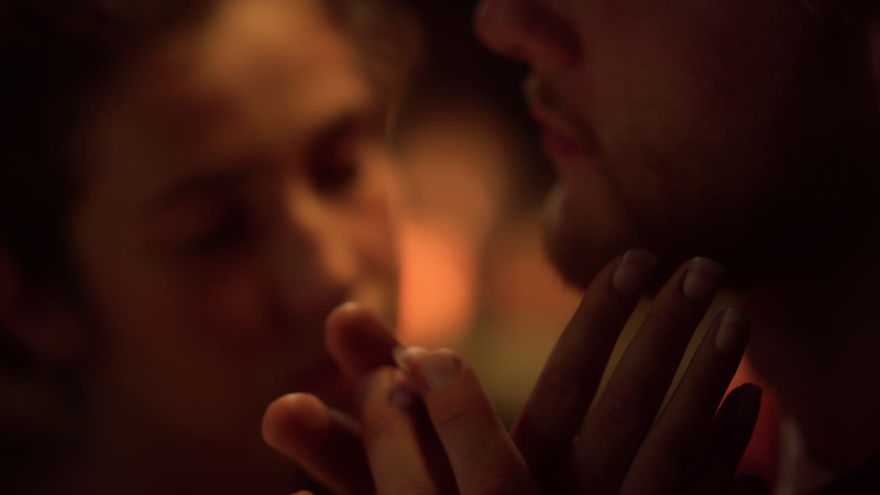 Closeup married couple enjoy love time on holiday. Sensual lovers touch face.