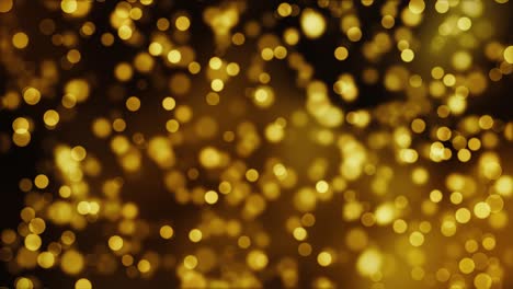 partículas flotantes doradas bokeh abstracto brillante polvo de oro llamarada bucle de estrellas fondo negro.