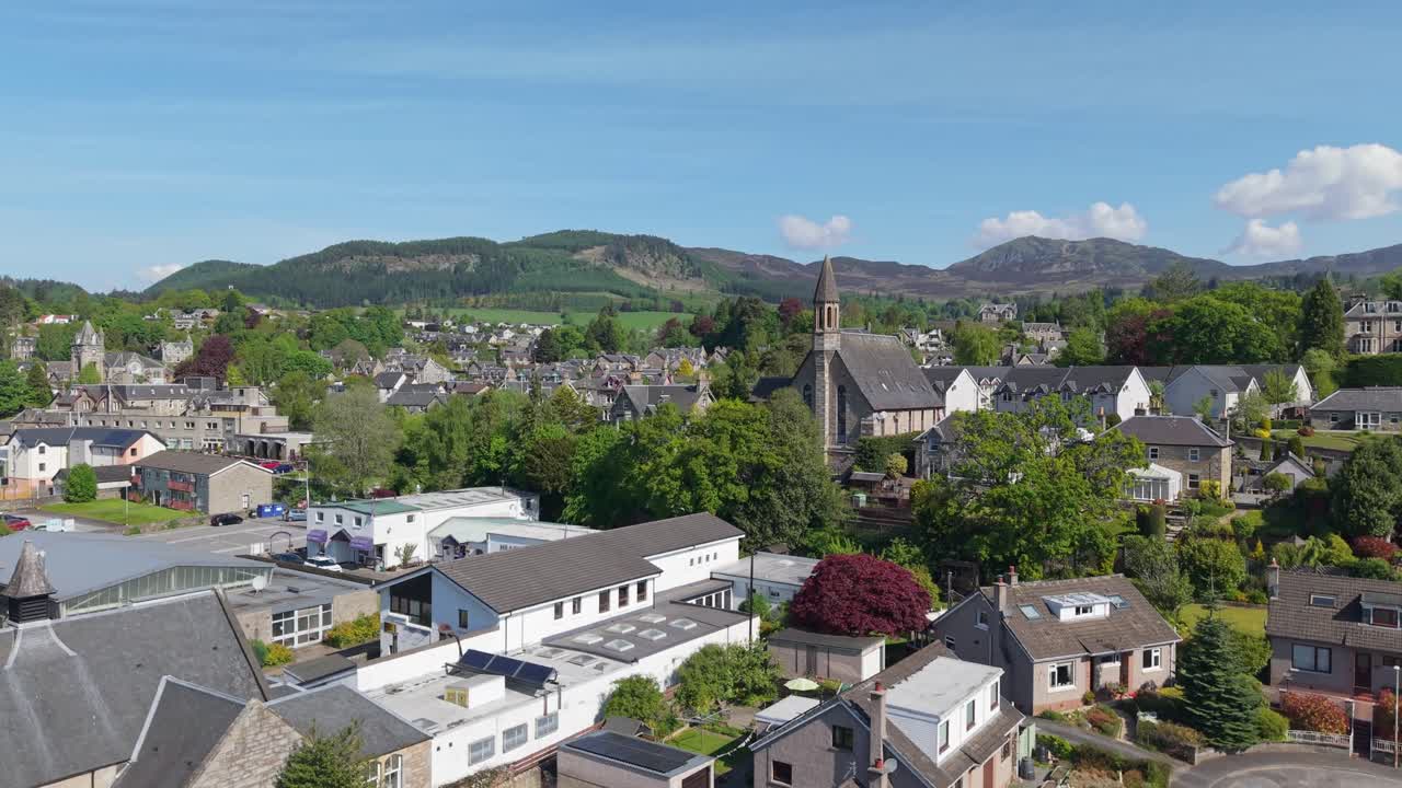Revealing the traditional village of Pitlochry, Scotland, with its charming streets, historic architecture, and scenic highland surroundings