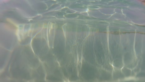 pov during swimming in the crystal water of salento (puglia)