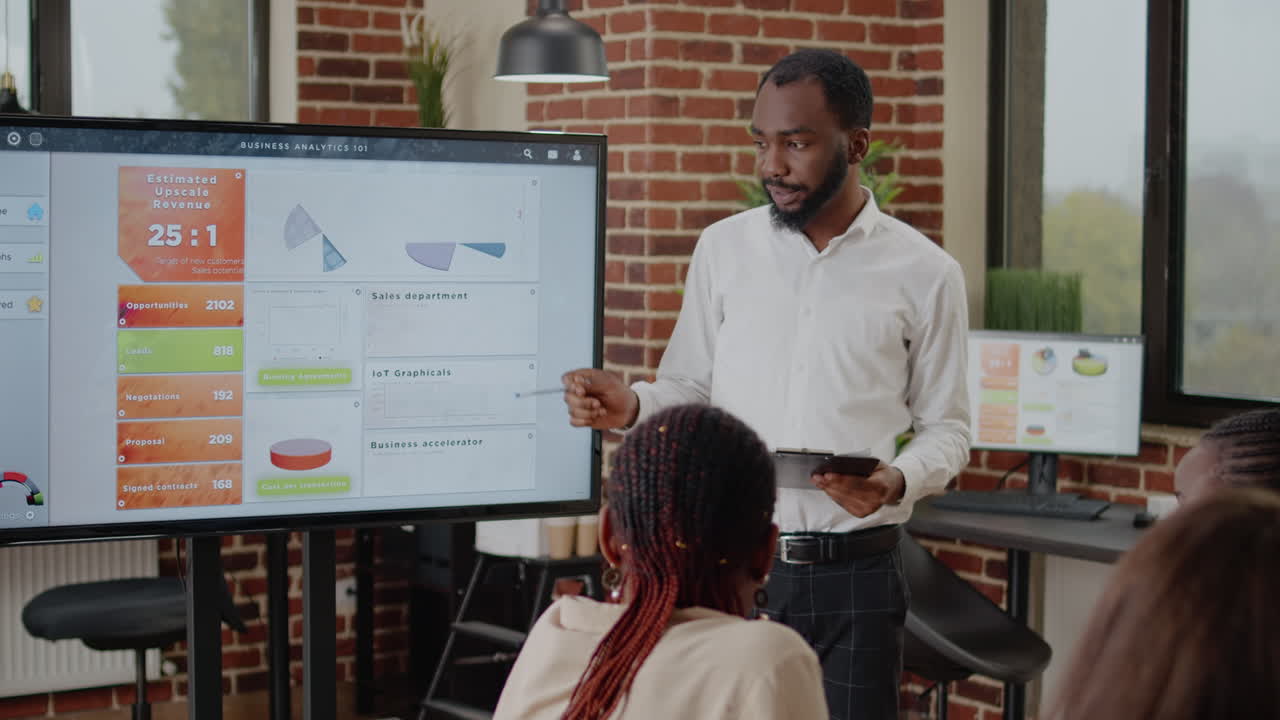 African american man doing financial presentation with charts