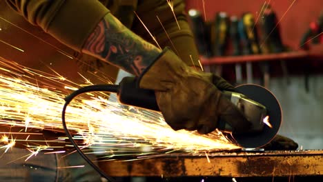 close-up of worker cutting metal with grinder. metal cutting electric tool