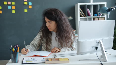 woman working at computer in home office