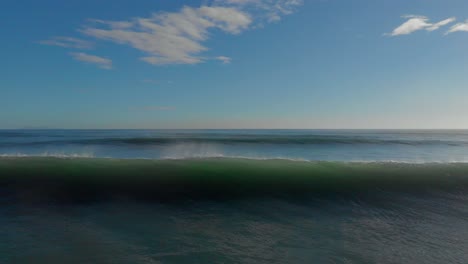 AERIAL:-Surfers-at-Mount-Maunganui-Beach,-New-Zealand