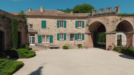 slow aerial dolly shot of a beautiful chateau under golden sunlight in france