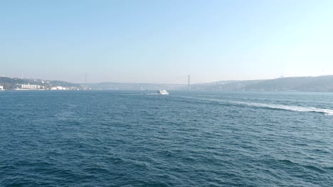 ferry boat crossing the bosphorus during sunny summer day in istanbul. blue water of golden horn, bosphorus and traveling on the boat on the sea in turkey. video 4k resolution