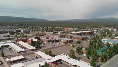 Daytime-aerial-of-West-Yellowstone,-located-near-the-west-entrance-of-Yellowstone-National-Park,-an-popular-destination-with-a-rich-history-and-a-variety-of-attractions-and-activities