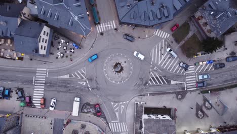 overhead dolly in flyover of a low-traffic traffic circle in the mountain village of benas in the autonomous community of aragon, spain