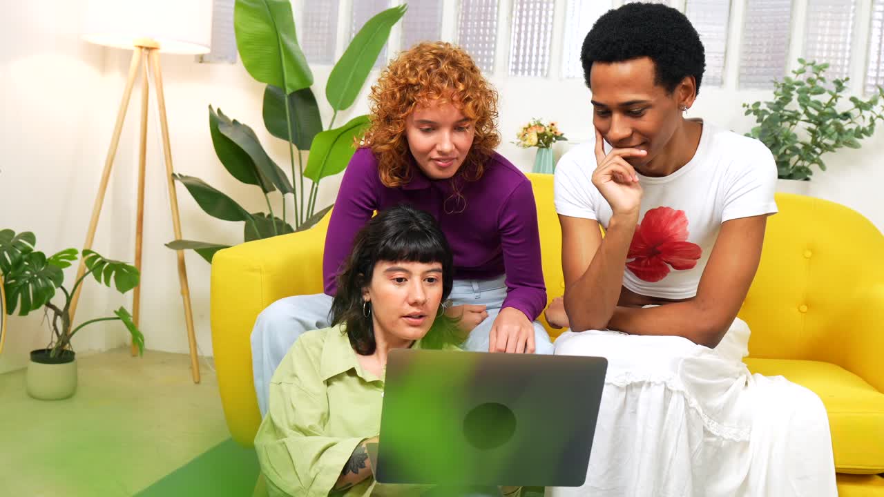 Friends Using Laptop at Home