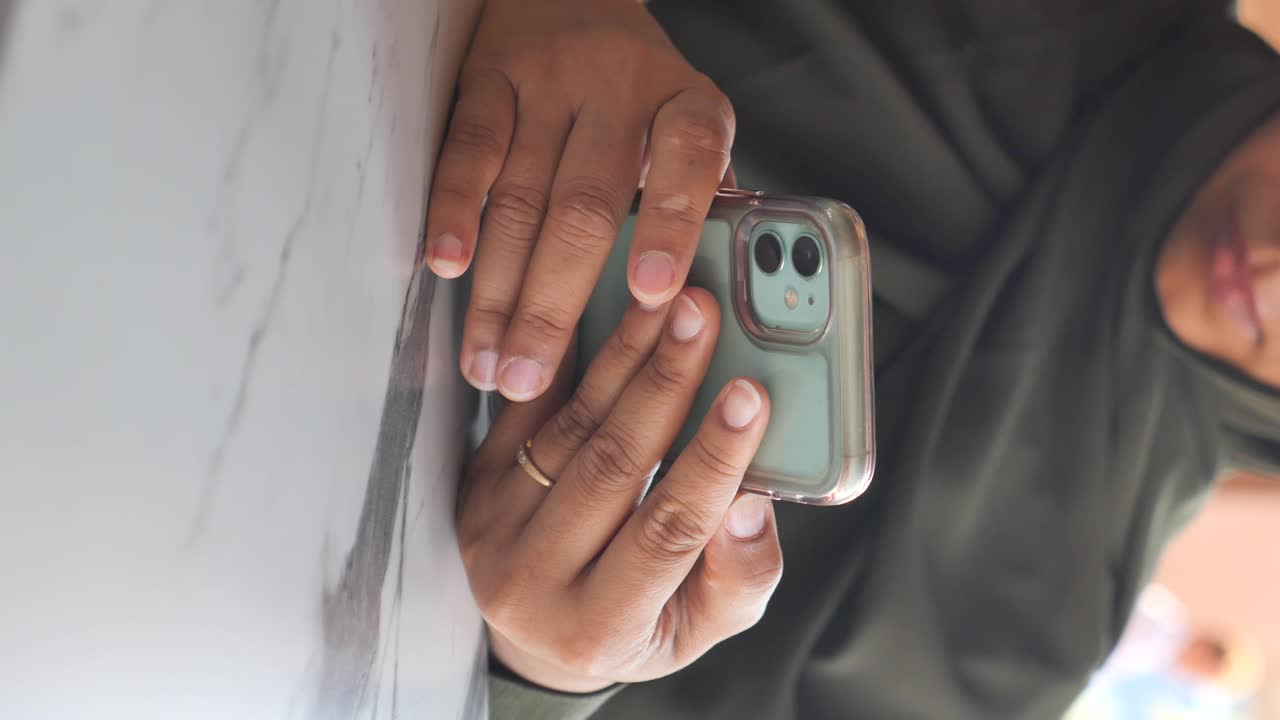 Close-up of hands holding a smartphone