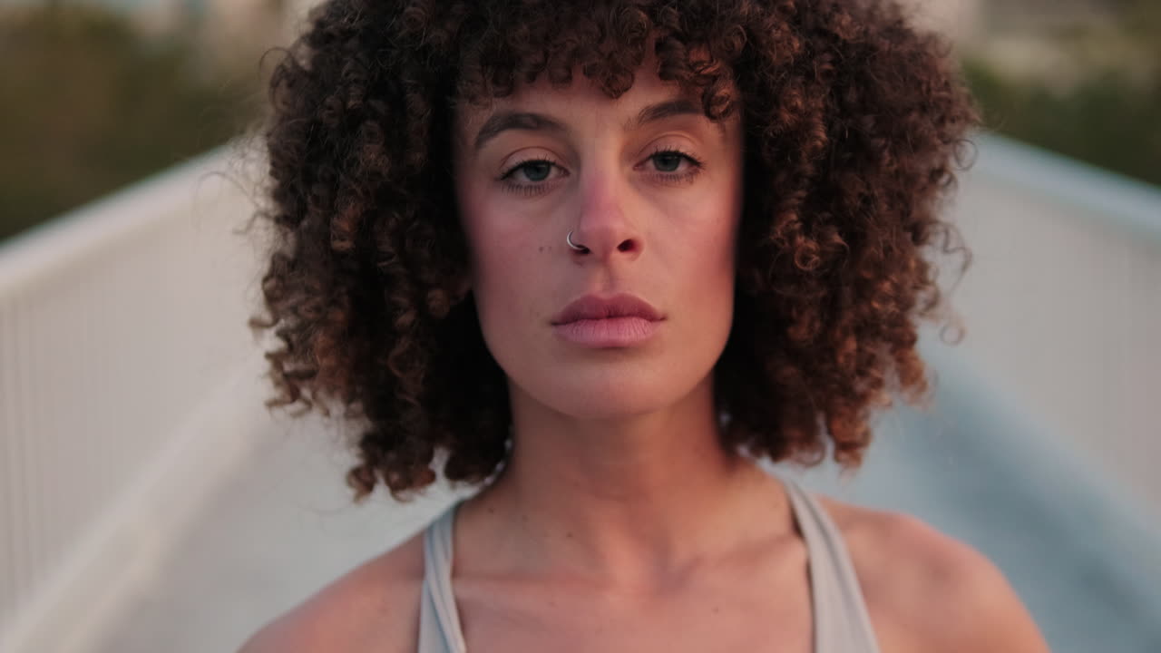 Confident Woman on Bridge in Sports Vest