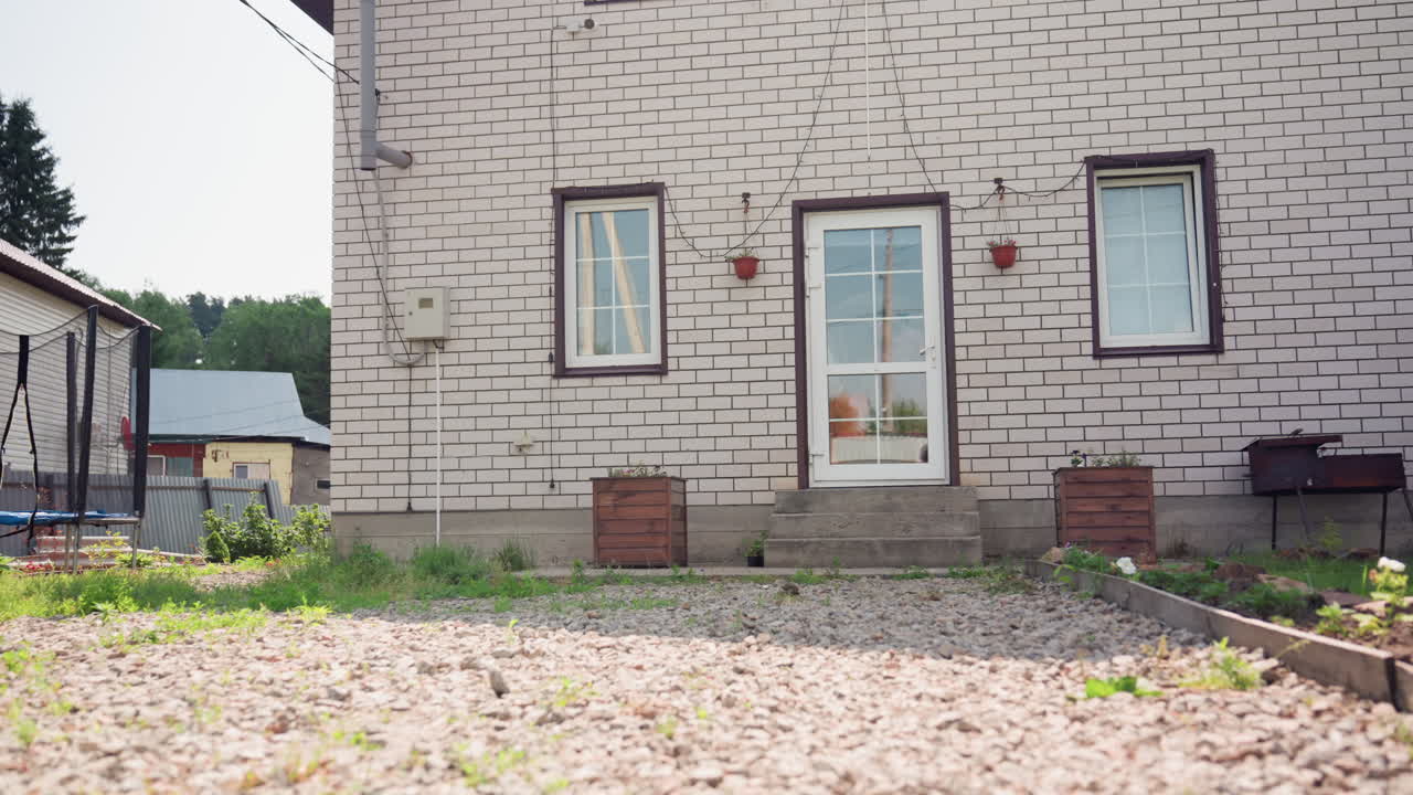 Lady Greets Home, Woman In Gown At Doorway, Female Figure In Pink At Entrance, Person Dressed In Pink Prepares To Enter House, Woman Wearing Pink Robe Steps Onto Porch Of Her Residence