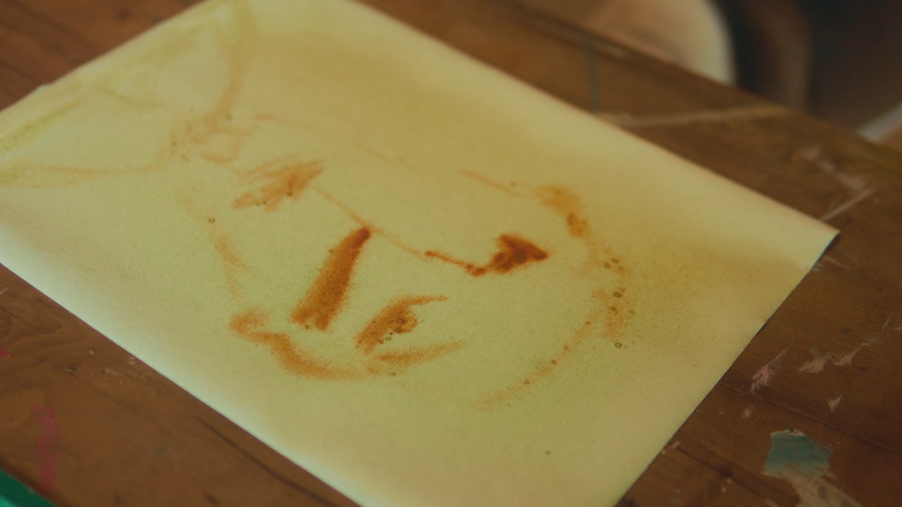 Abstract artwork on paper with warm color strokes and organic shapes creative indoor art scene
