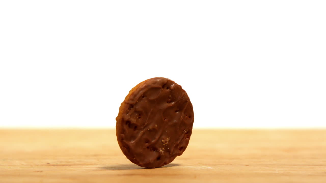 Biscuit spinning on wooden table