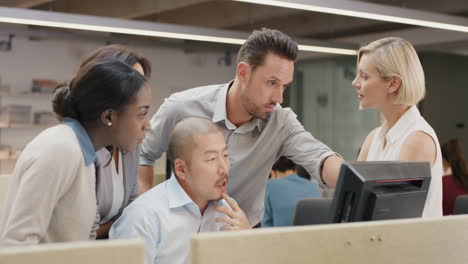 an attractive young business team are having a conversation in a bright, modern office building. they are bathed in sunlight which is streaming through the windows. in slow motion.