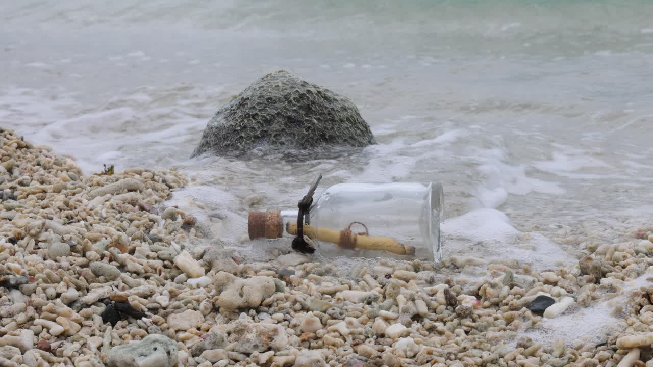 Message in the bottle on a sand beach