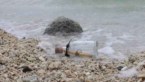 message in the bottle on a sand beach