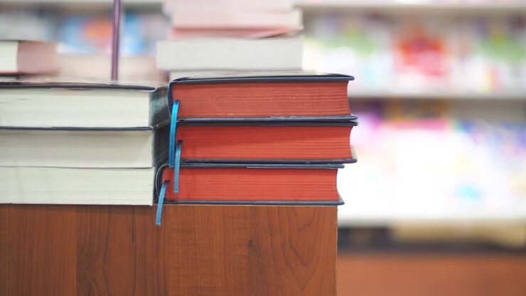 Stack of Books on a Wooden Table