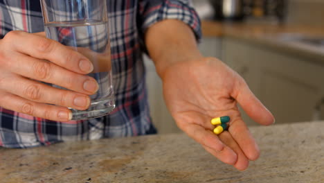 a woman taking a pill