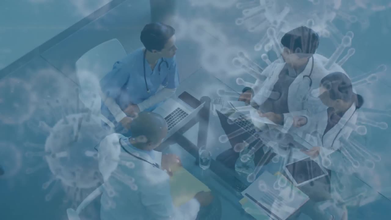 코로나19 세포가 의사들의 팀을 상대로 움직이고 있습니다.