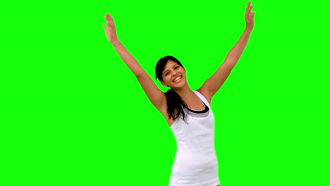 Woman-in-sportswear-stretching-her-arms-on-green-screen