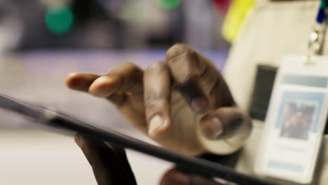 vertical video close up of engineer using tablet to design solar panels factory layouts