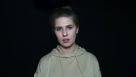 portrait of a young woman wearing a hoodie