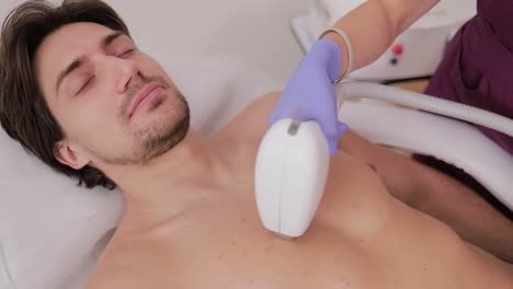 man receiving laser hair removal treatment