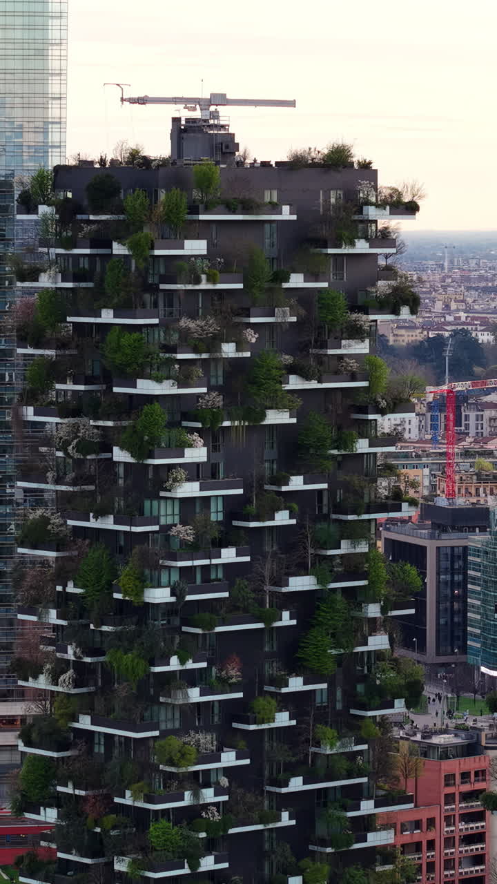 Aerial drone view of the Vertical Forest complex of residential skyscrapers in Milan, Italy in daylight. Vertical