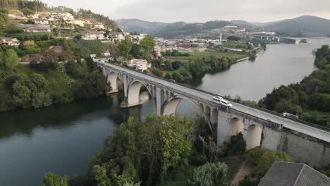 aerial parallax motion, over scenic bridge, entre-os-rios, douro valley - portugal