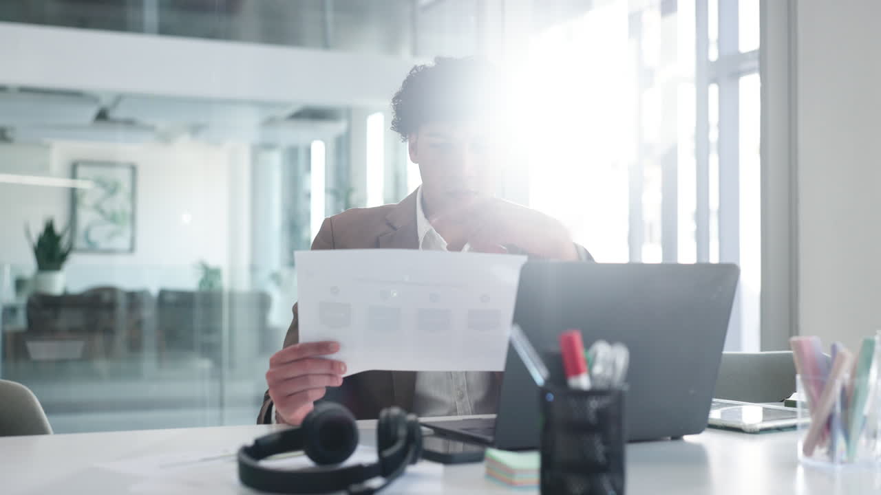 Man working on laptop in office