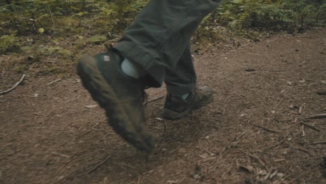 Close-up-shot-of-man-hiking-in-the-woods-of-the-Pacific-Northwest