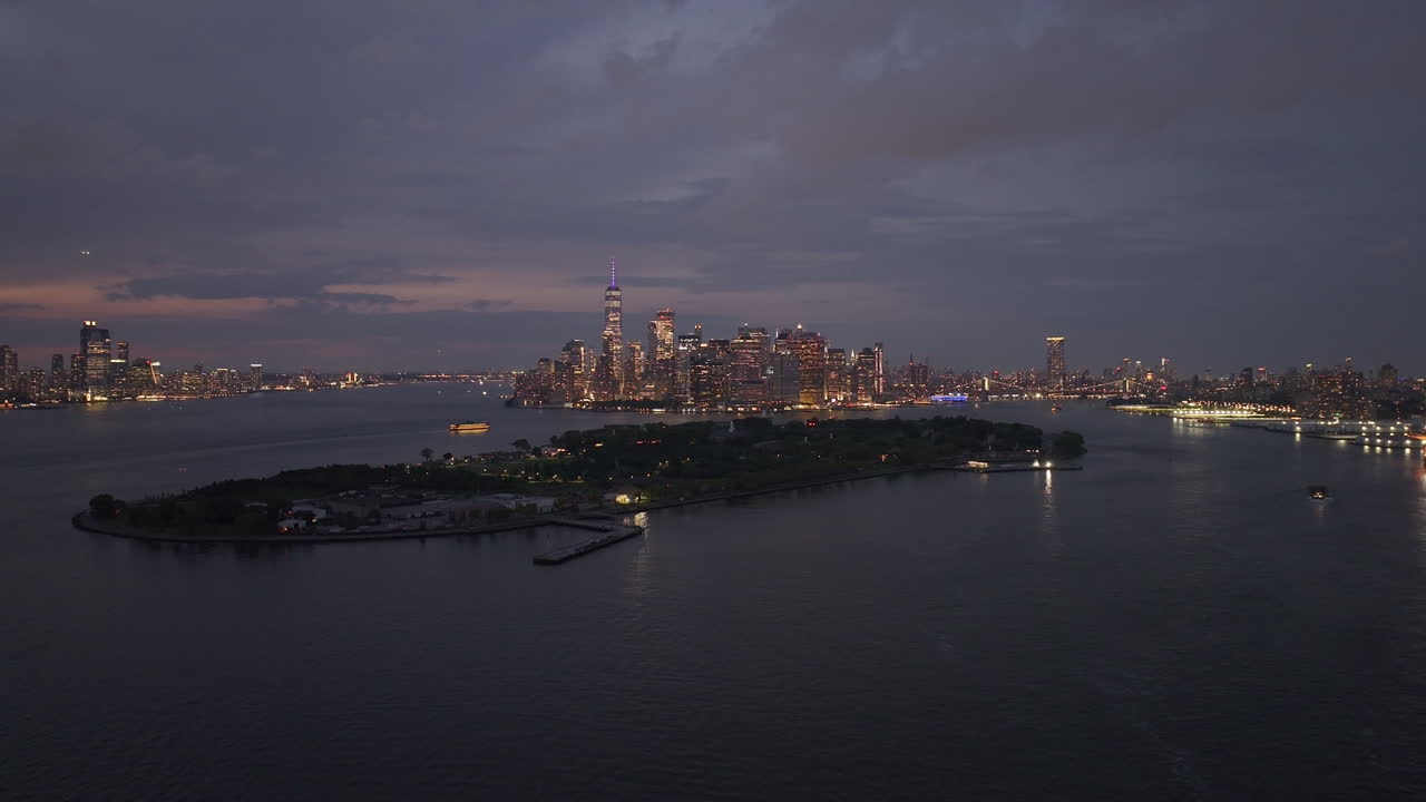 Aerial view of Brooklyn and the Manhattan skyline at night. Shot in Red Hook along the New York Harbor and Governor's Island.