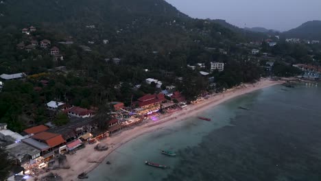 aerial view of a tropical coastal town at dusk