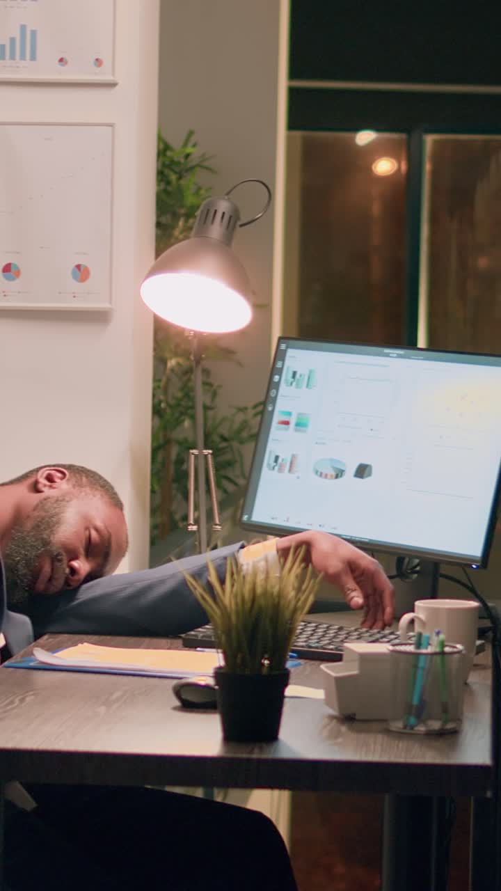 Vertical video Coworker dissaproving of asleep employee