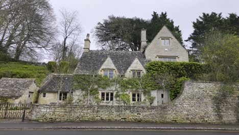 old and preserved house at the main street in bibury, cotswolds, england, united kingdom - march 2024