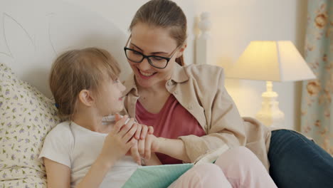 mother and daughter reading together